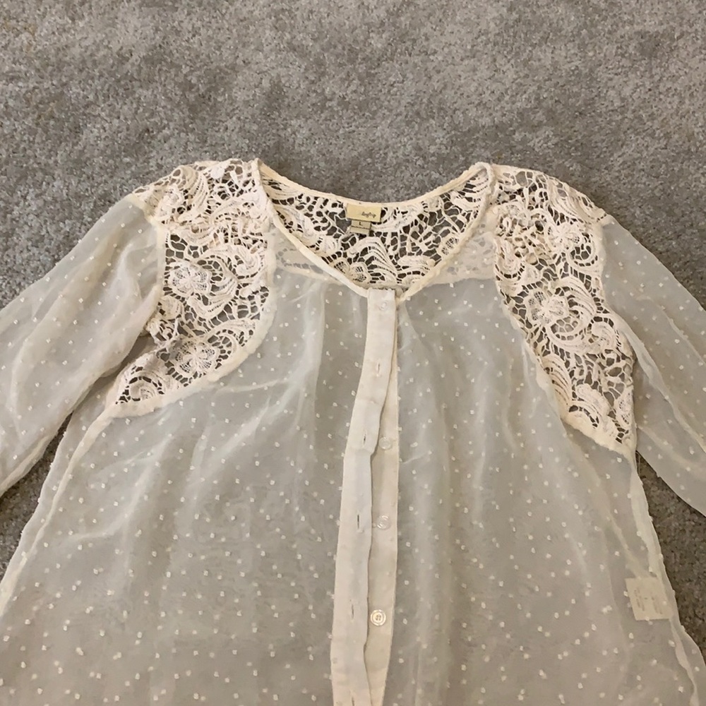 Woman’s button up blouse.